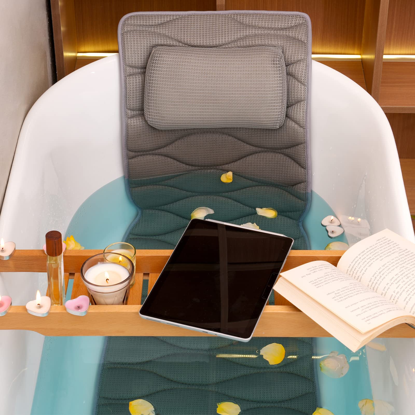 OMYSTYLE gray bath pillow resting in tub ready for a relaxing soak