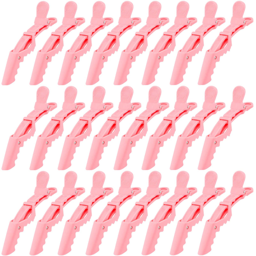 Ondder pink alligator clip for hair sectioning with secure hold during styling.