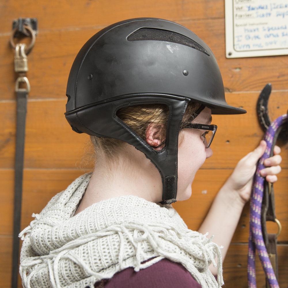 One Knot Hairnet securely holds thick, long hair during rides.