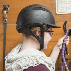 One Knot Hairnet securely holds thick, long hair during rides.