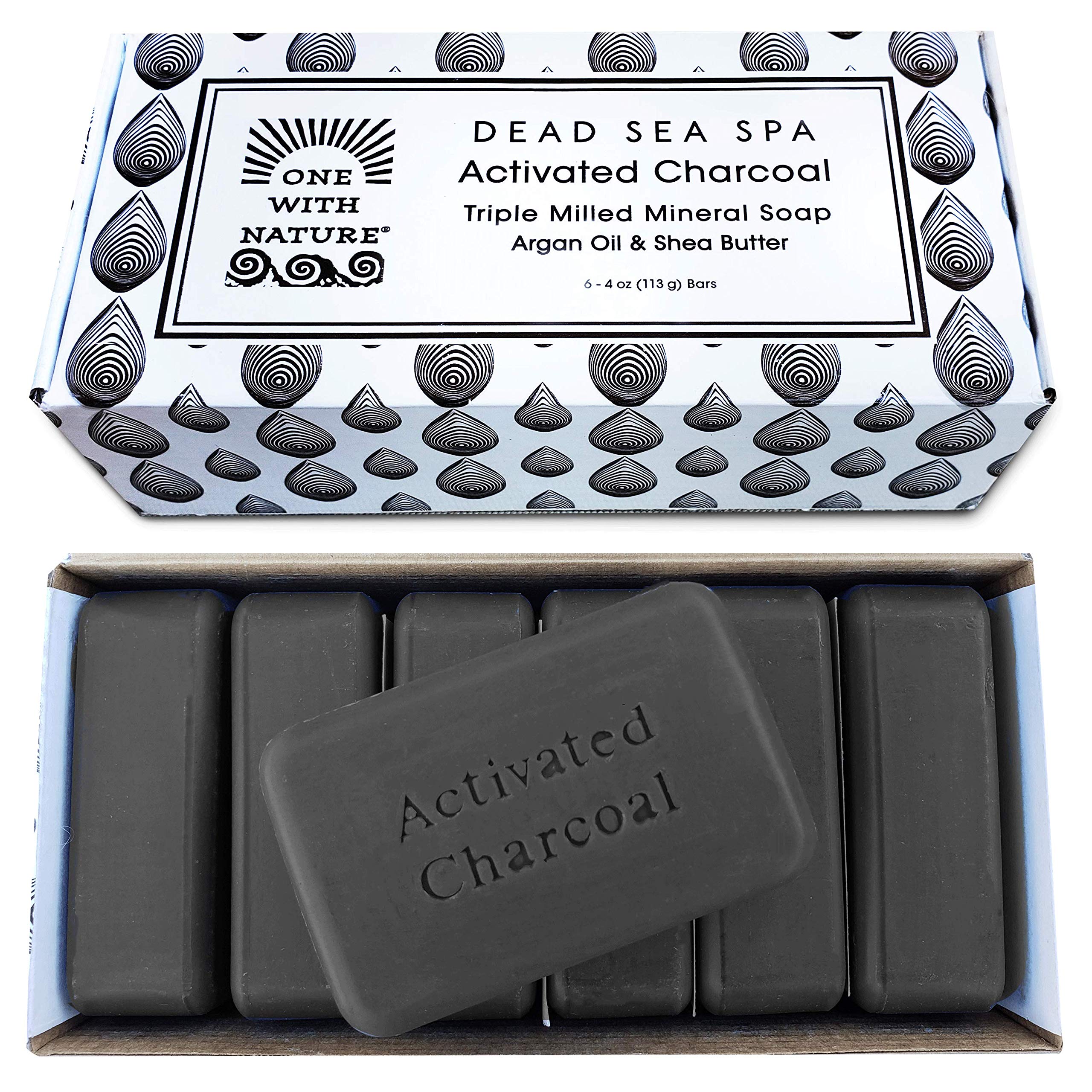 One With Nature charcoal soap bar foreground for detoxifying cleansing and brighter pores.