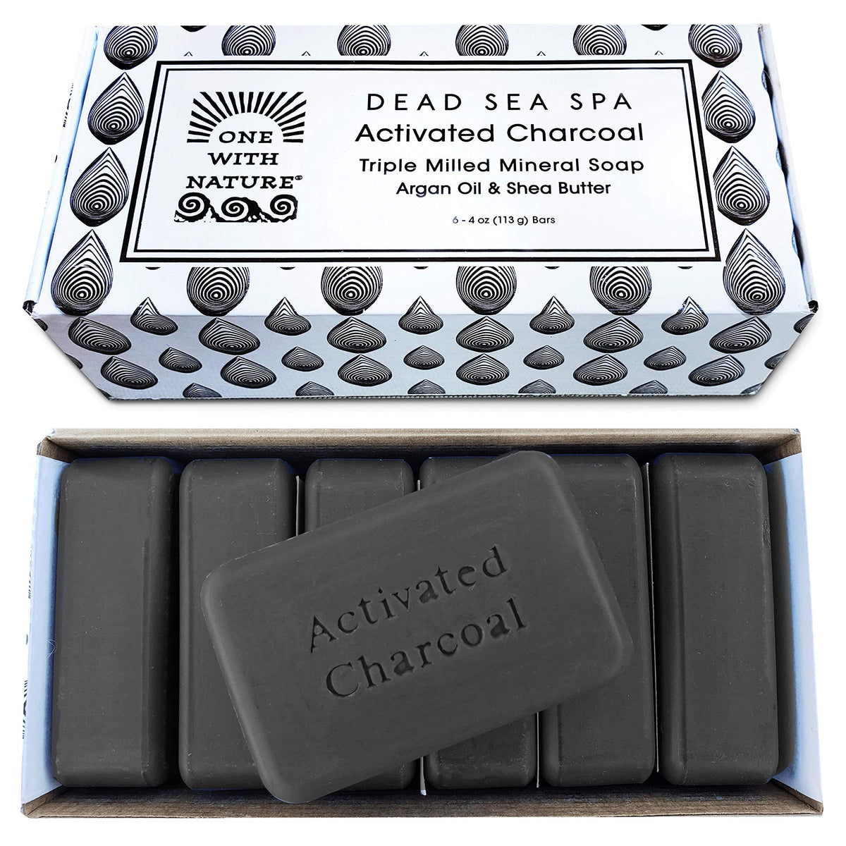 One With Nature charcoal soap bar foreground for detoxifying cleansing and brighter pores.