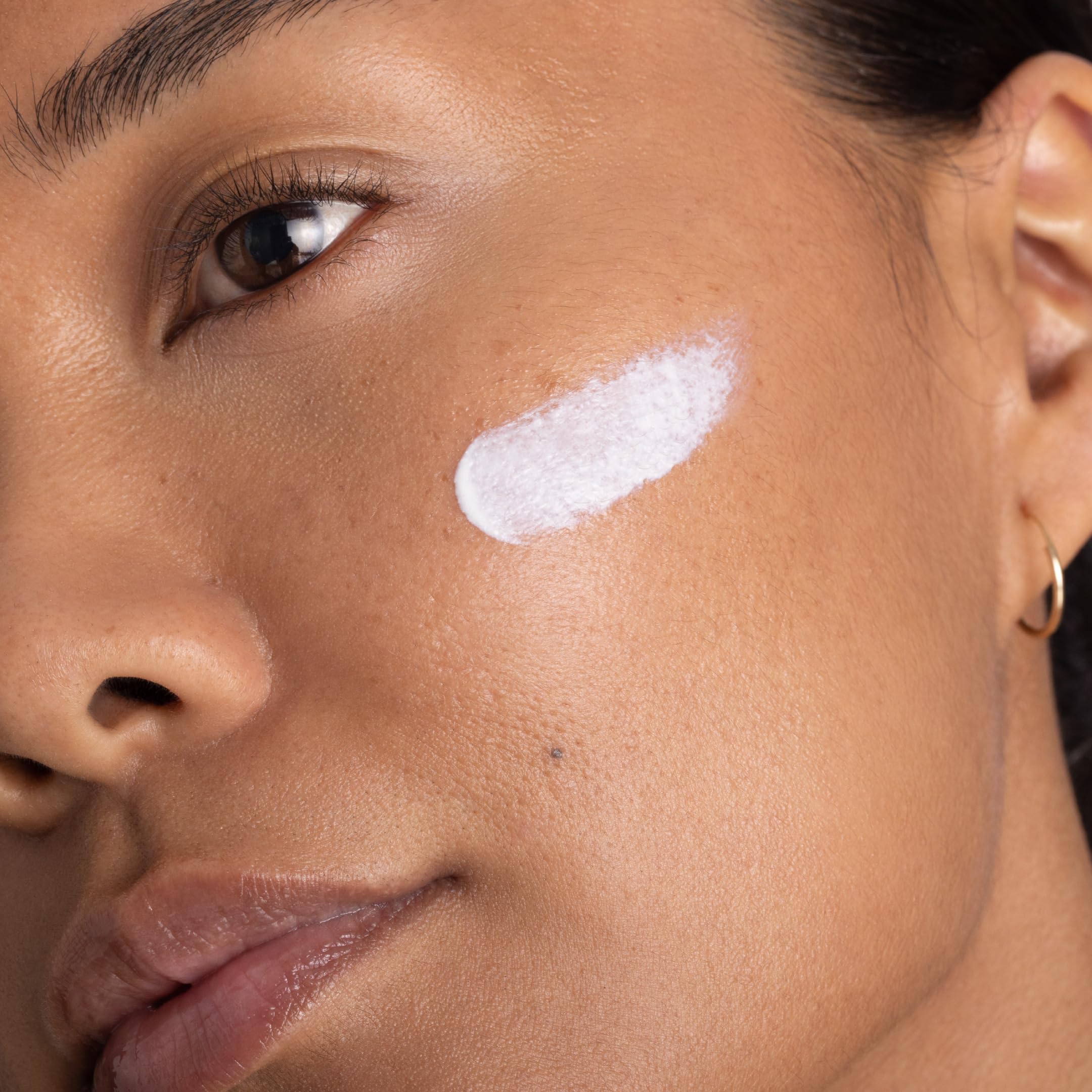 OneSkin FACE SPF OS-01 swatch demonstrates sheer tint blending.