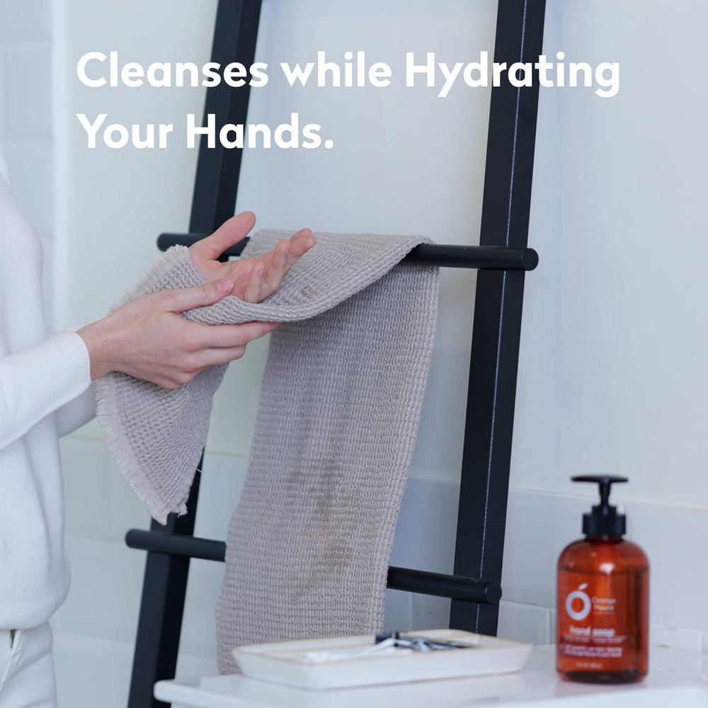 Orange House hand soap on bathroom counter for daily handwashing.