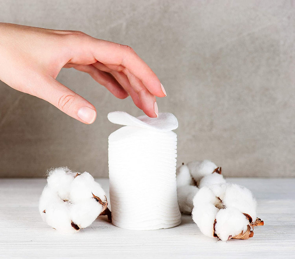 Organyc cotton rounds in biodegradable packaging, eco-friendly.