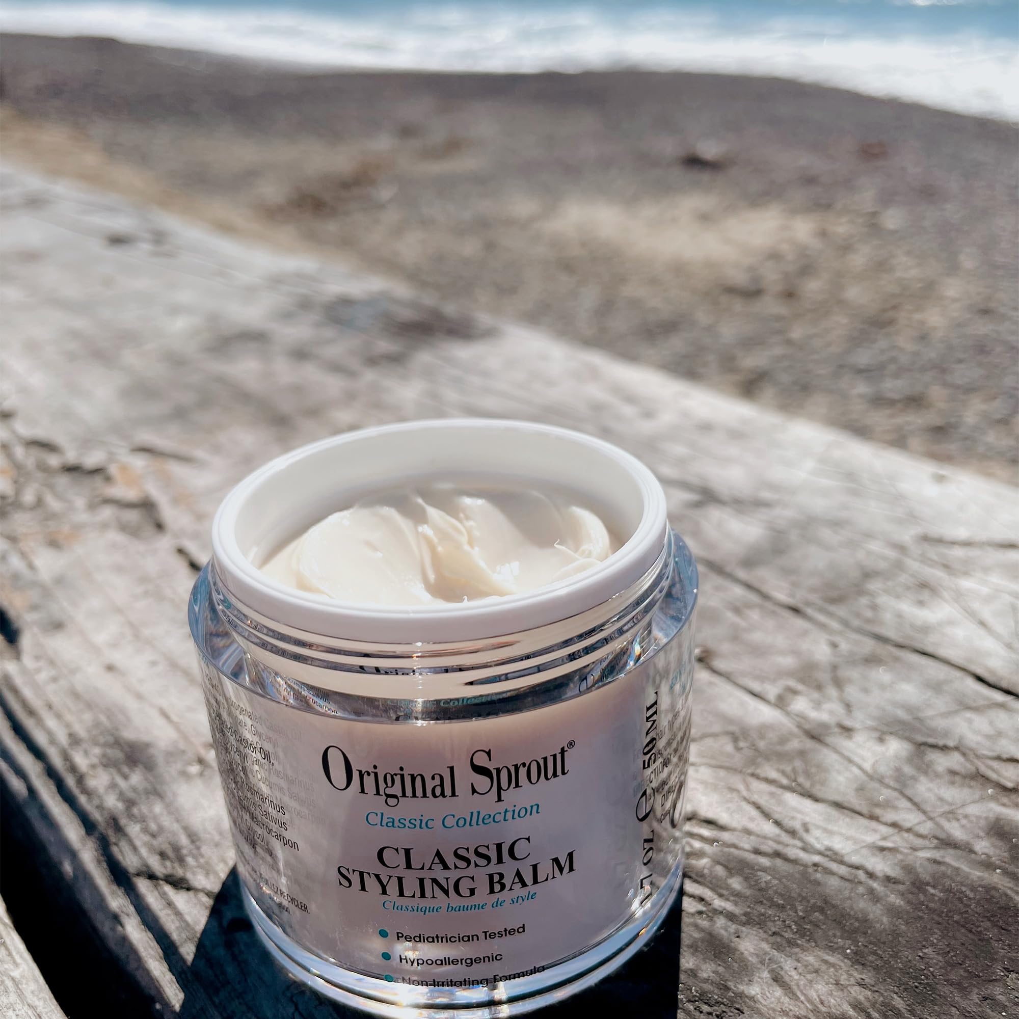 Original Sprout balm on dry hair to tame frizz and flyaways.