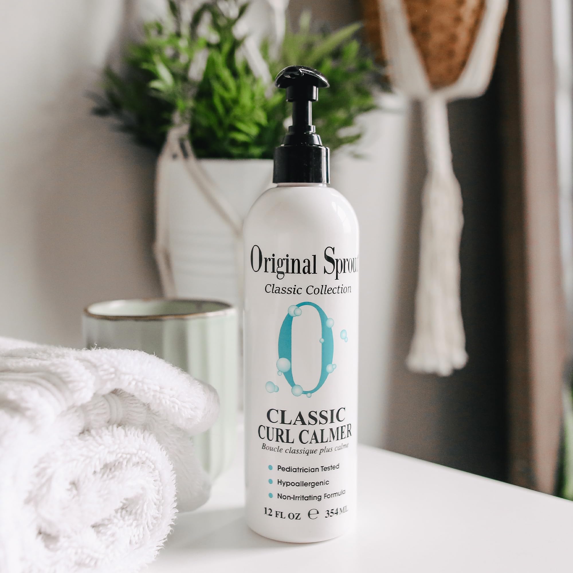 Original Sprout Curl Calmer applied to damp hair for easy styling.
