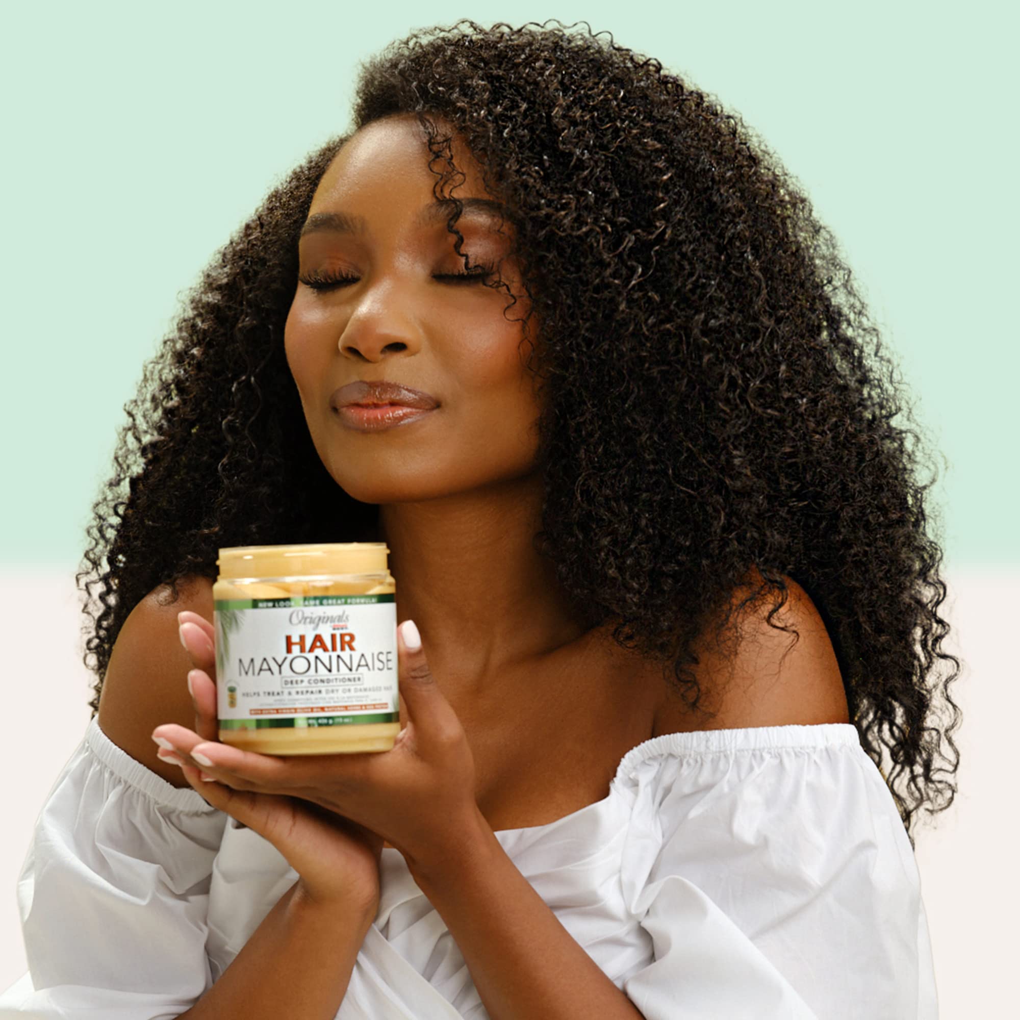 Originals by Africa's Best hair mayonnaise damp-hair application showcasing easy distribution and deep moisture.