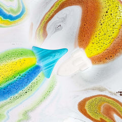 ORIGLAM Space Rocket bath bomb releases color trails for engaging bath-time visuals.