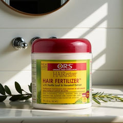 ORS HAIRestore cream-texture swatch reveals rich moisture for scalp comfort.