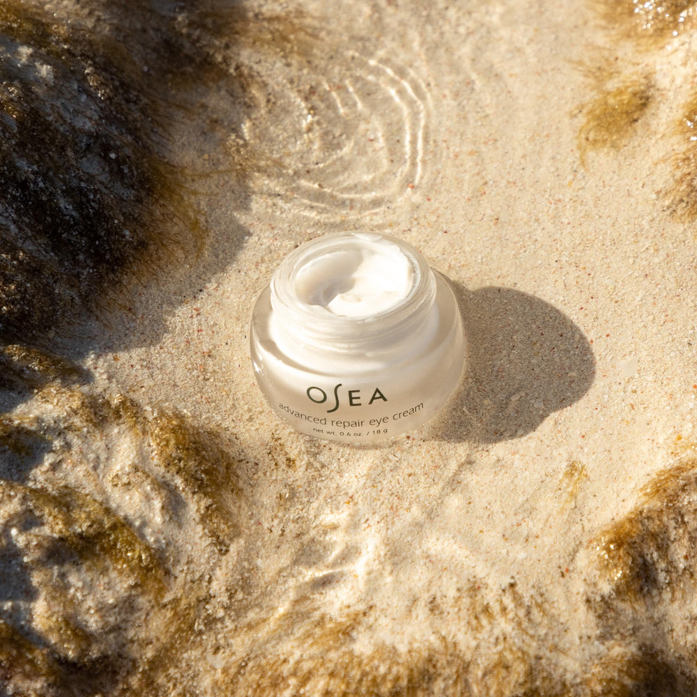 OSEA Advanced Repair Eye Cream applying under-eye area for smoother look.