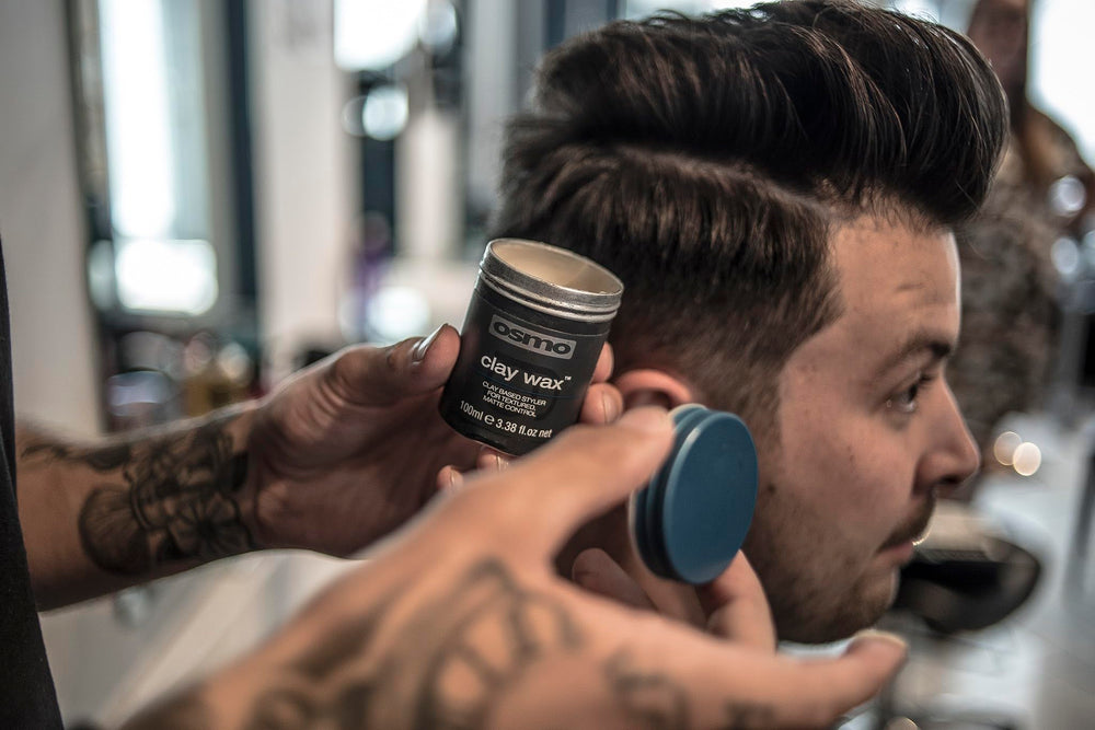 Osmo Firm Hold Clay Wax on hair model displaying defined texture