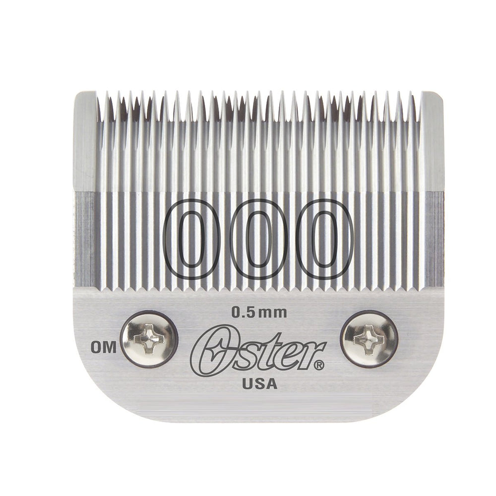 Oster detachable blade closeup shows 0.5 mm cut for precise fades.