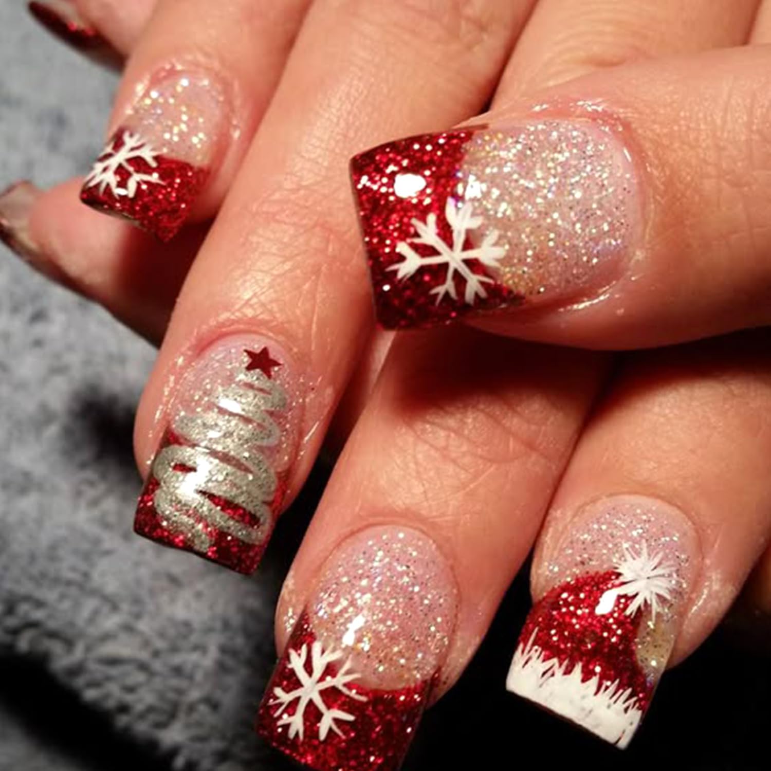 OSTTMA french tip nails with gold accents arranged in kit layout.