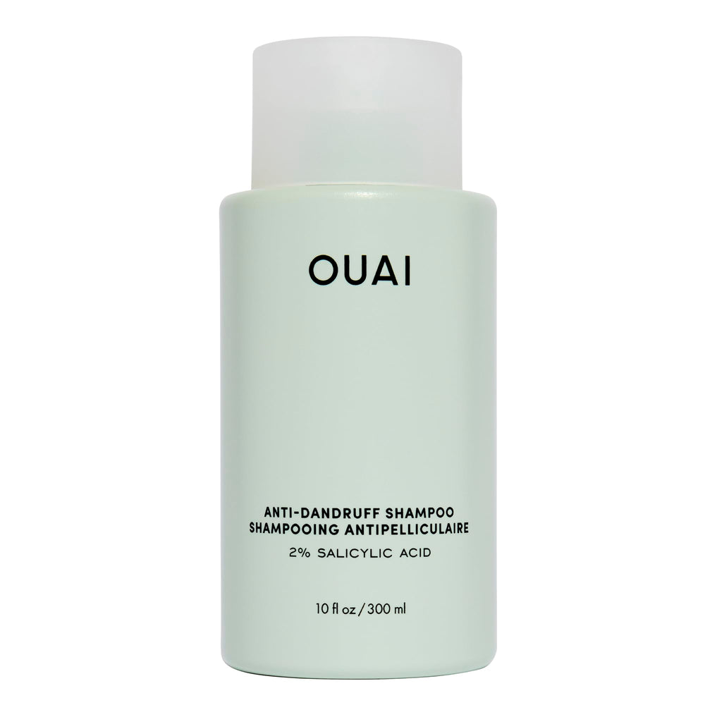 OUAI anti-dandruff shampoo bottle pour showing soothing scalp relief