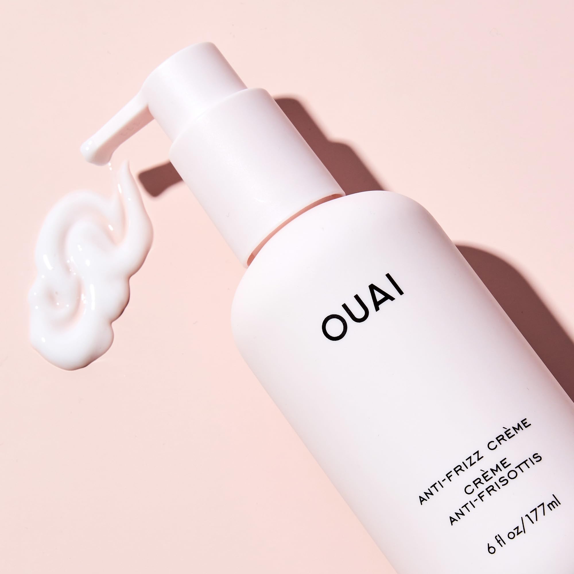 OUAI anti-frizz cream packaging label highlights travel-friendly size and clean ingredients.