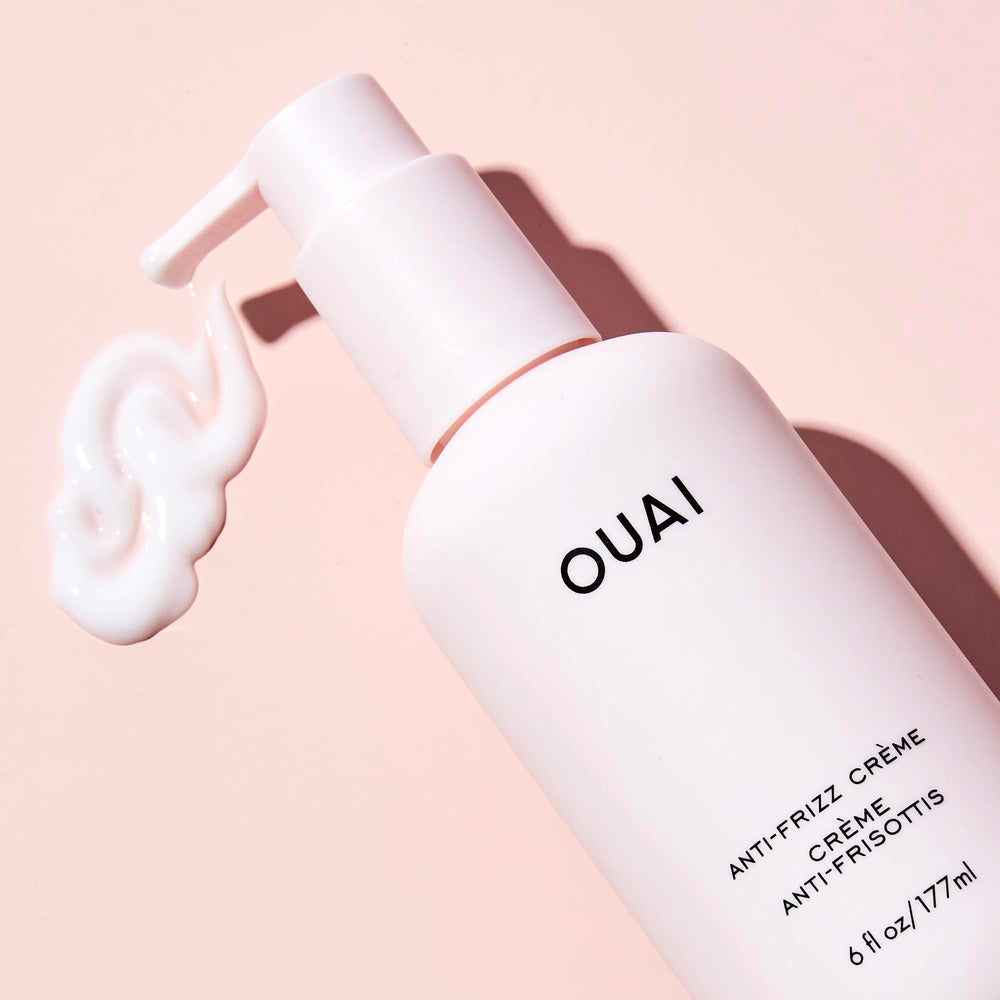 OUAI anti-frizz cream packaging label highlights travel-friendly size and clean ingredients.