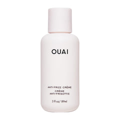 OUAI anti-frizz cream travel size bottle shows portable frizz control for on-the-go styling.