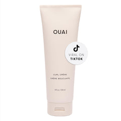 OUAI Curl Cream on wet hair showing defined, bouncy waves