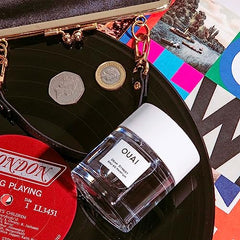 OUAI Dean Street glass bottle with mist demonstrates even application and lasting fragrance.