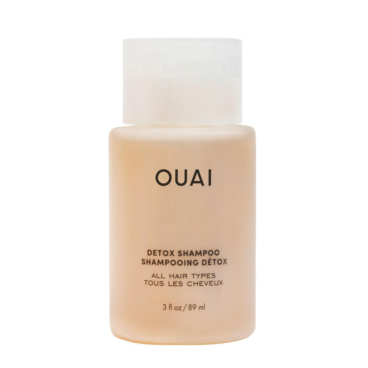 OUAI Detox Shampoo travel-size bottle shows clarifying formula for quick refresh and buildup removal