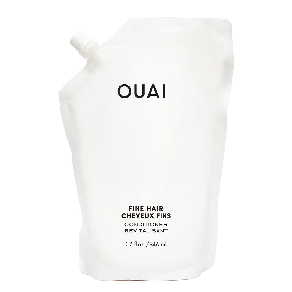 OUAI Fine Hair Conditioner Refill bottle closeup shows glossy hair-softening potential for volume and shine.