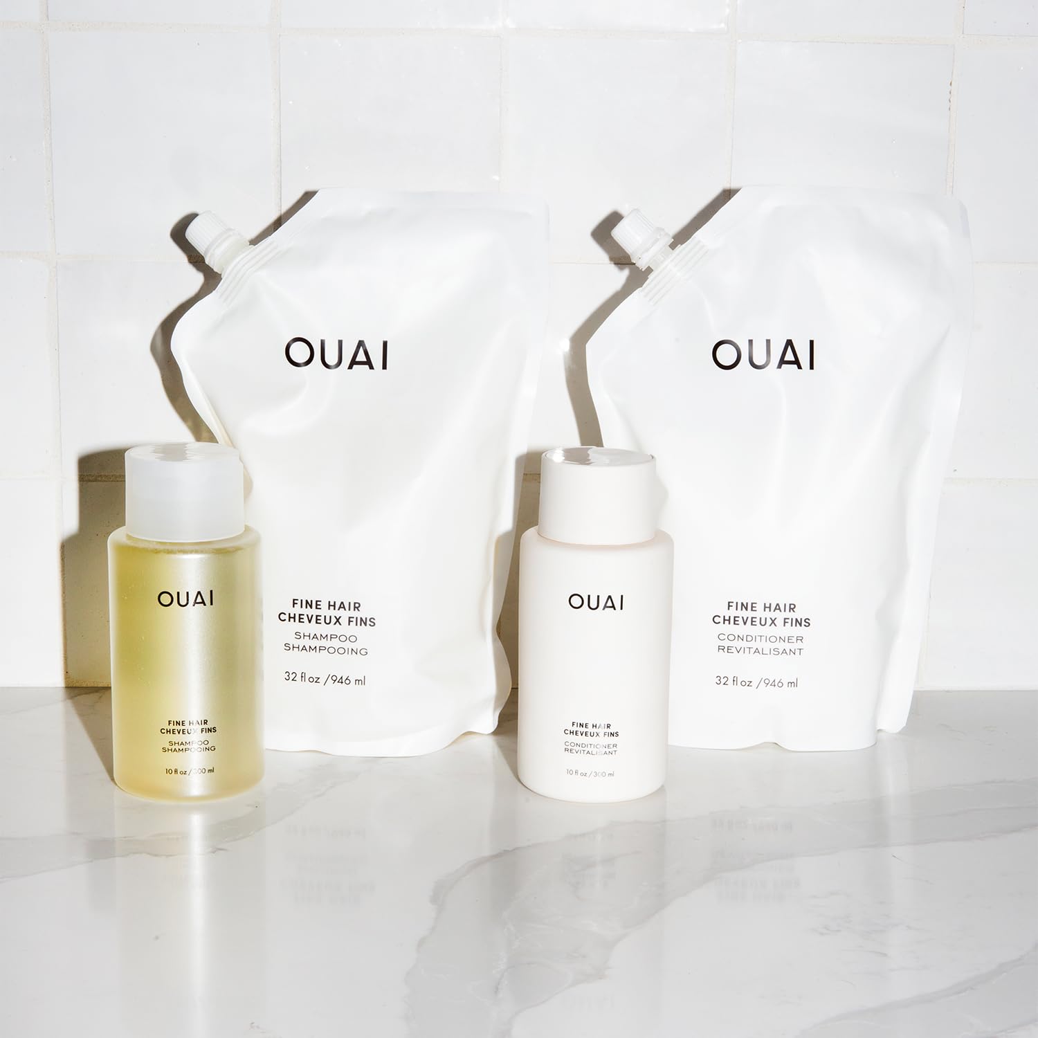 OUAI Soft silky hair closeup demonstrates smooth, touchable finish after use.