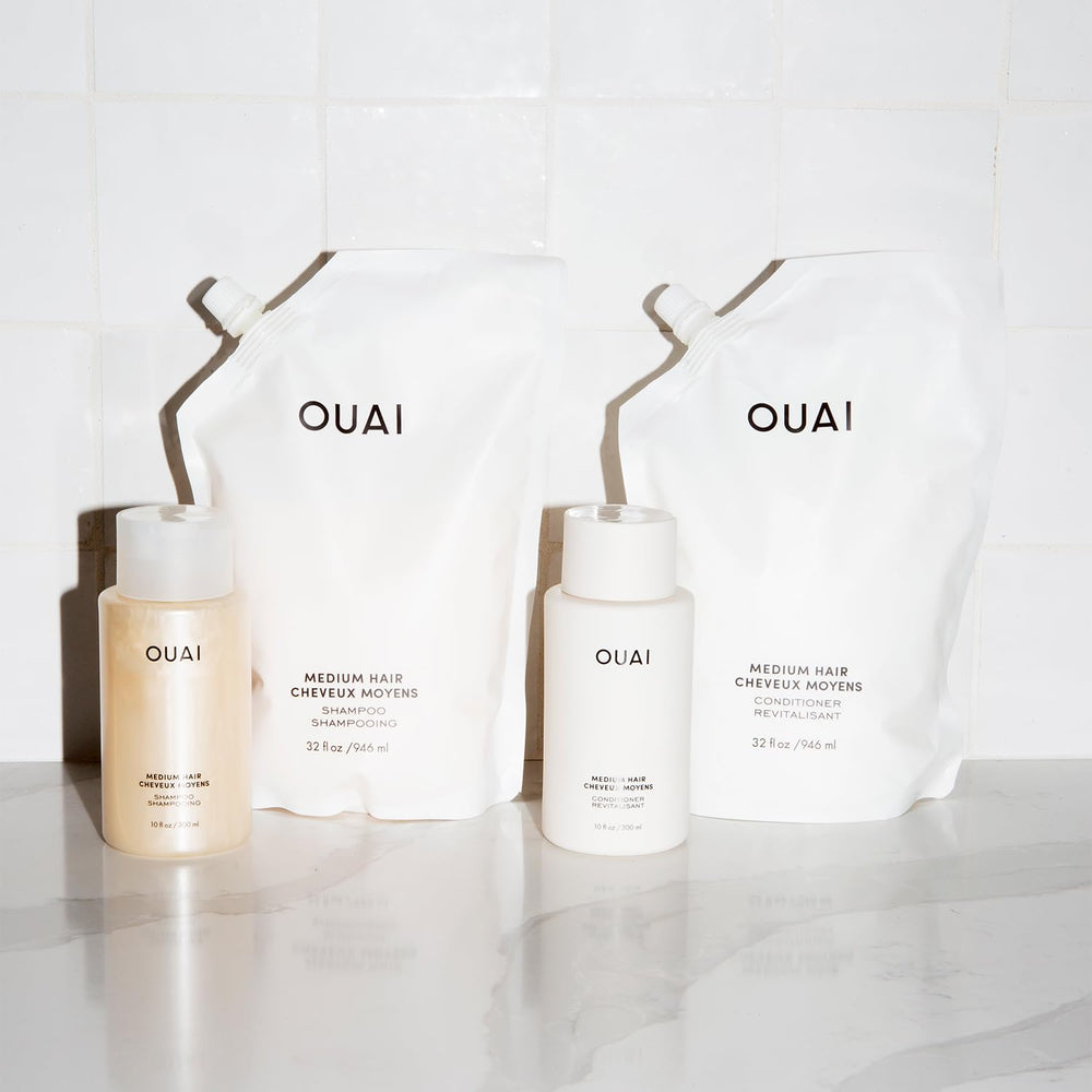 OUAI Medium Shampoo lathering in hand demonstrates cleanse and moisturization