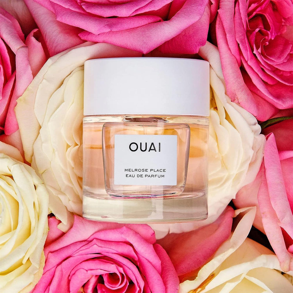 OUAI Melrose Place spray gesture shows easy, lightweight application for daily wear.