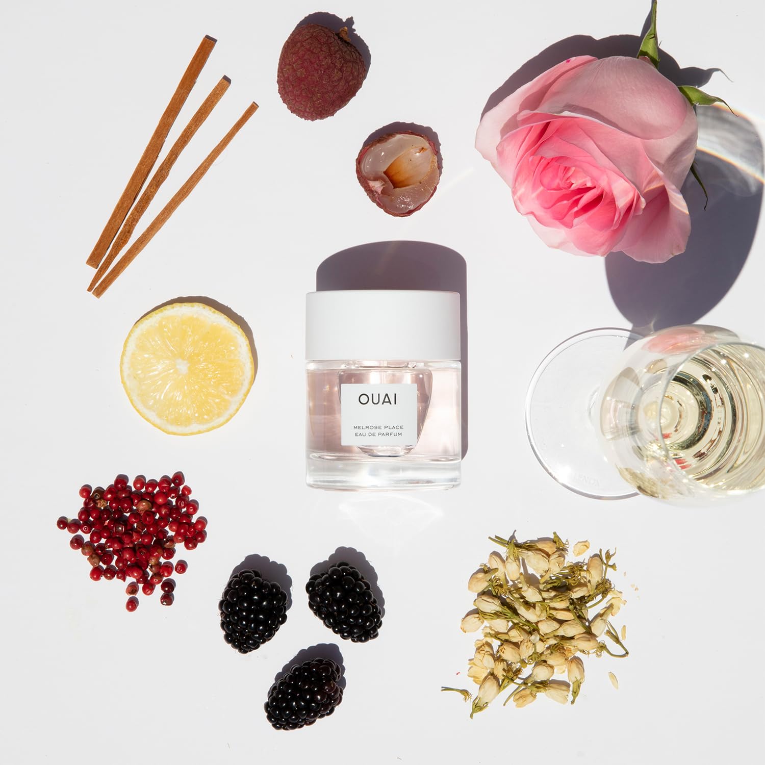 OUAI Melrose Place wood-based base notes of amber and cedarwood for lasting warmth.