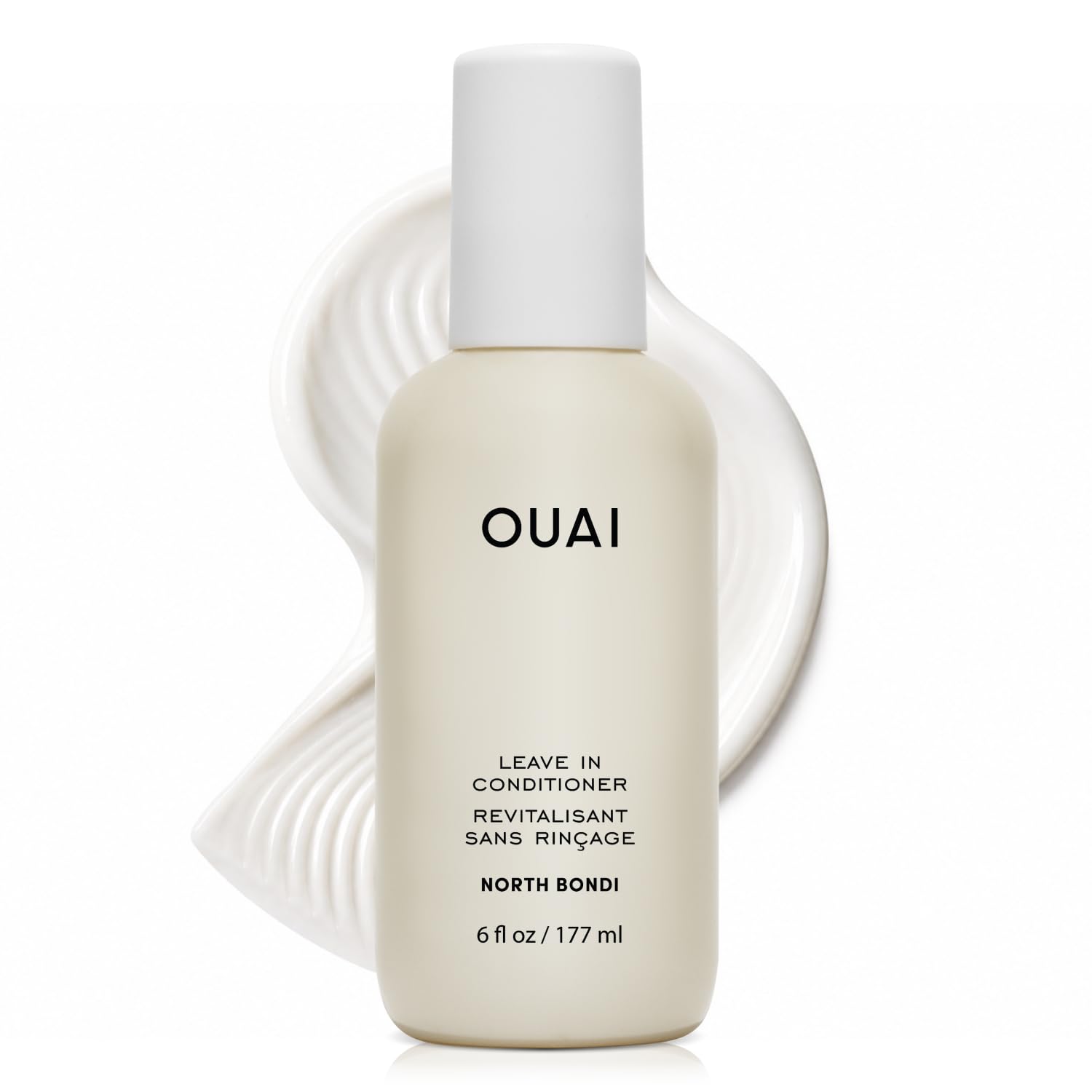 OUAI bottle front packaging showing product and benefit of detangling
