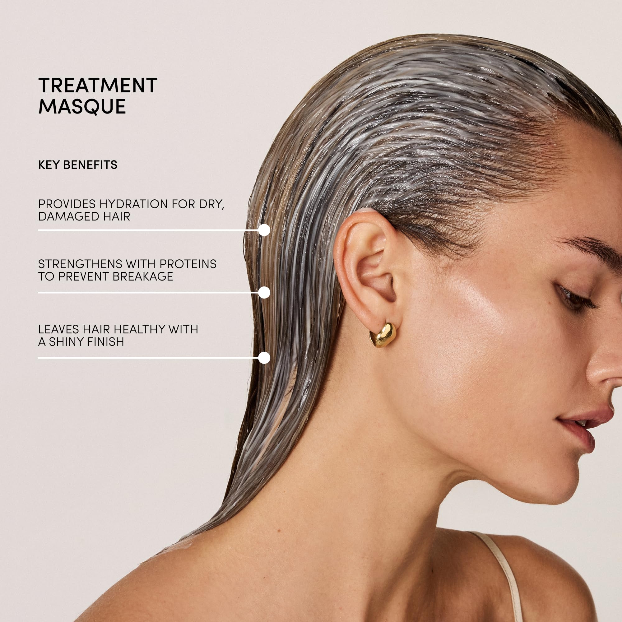 OUAI panthenol shine-boost action seen on damp hair during application