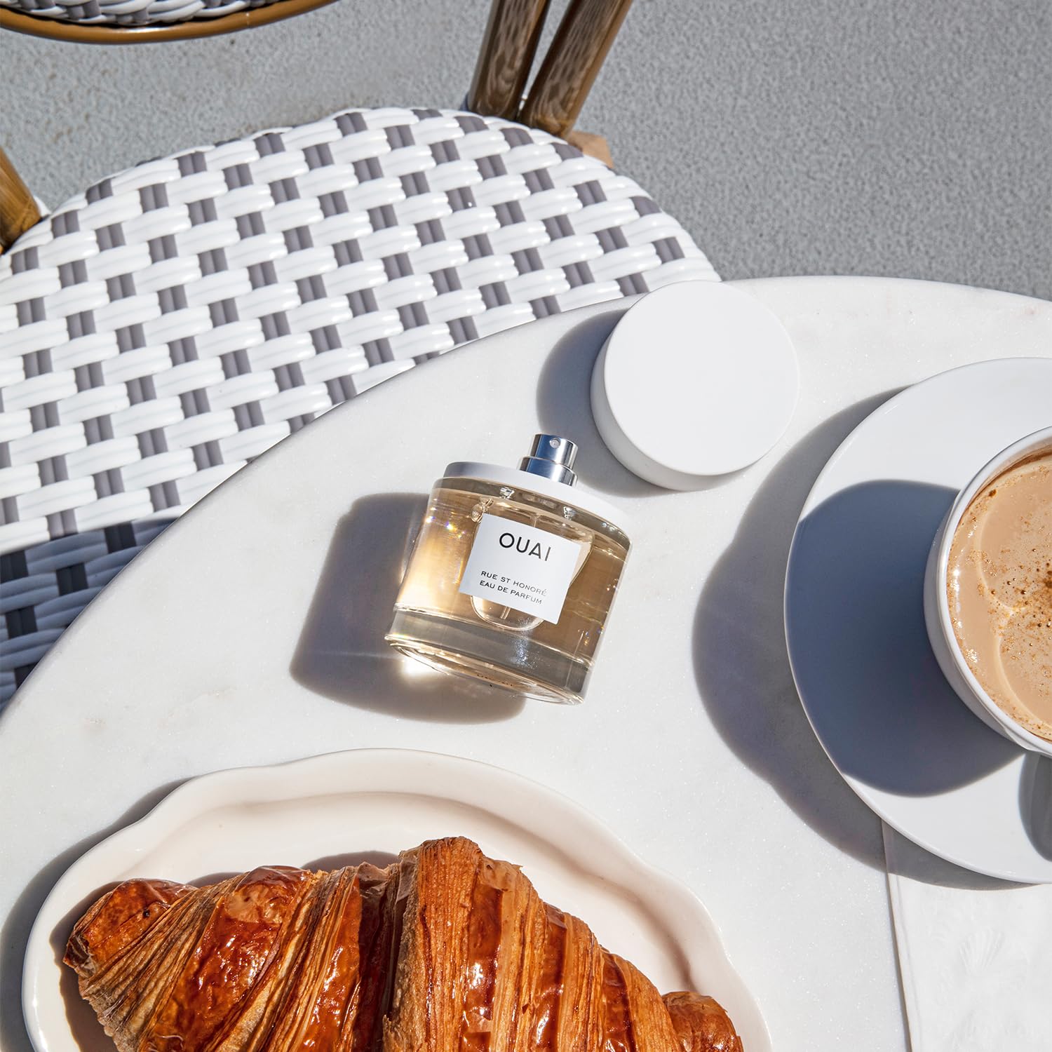 OUAI Rue St. Honore wrist application shows precise scent layering.
