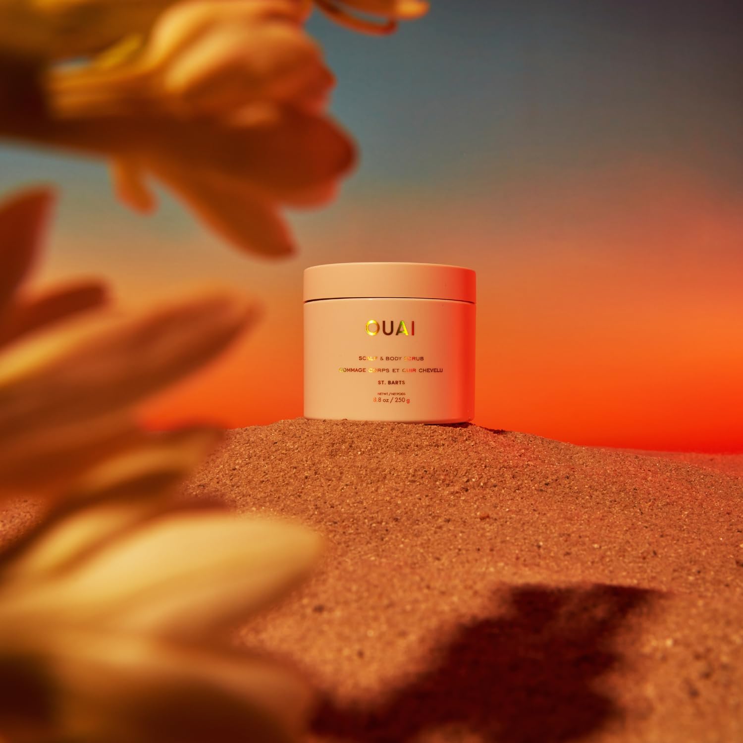 OUAI Scalp & Body Scrub applied with hands for effortless routine integration.