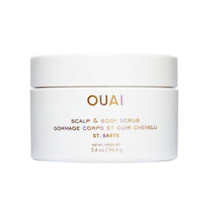 OUAI Scalp & Body Scrub travel-size bottle for on-the-go exfoliation and clean skin.