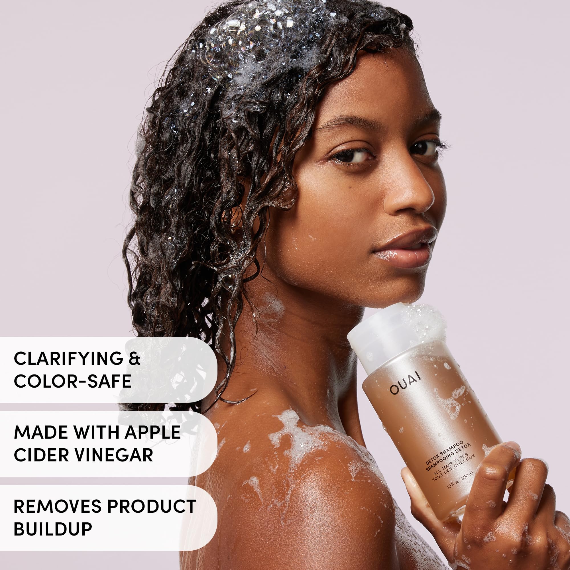 OUAI detox shampoo being applied to scalp during shower ritual.