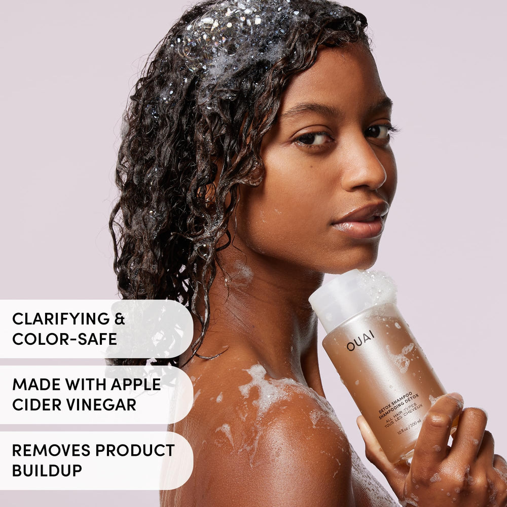 OUAI detox shampoo being applied to scalp during shower ritual.