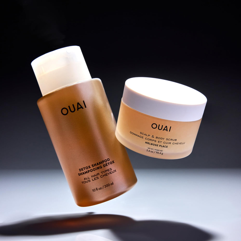 Exfoliating sugar crystals in OUAI scrub texture for gentle skin renewal.