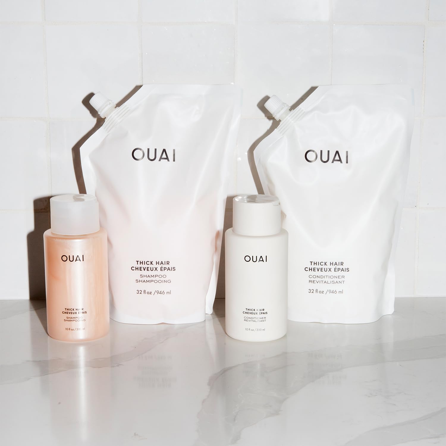 OUAI Thick Hair Conditioner label shows keratin and shea butter for softness.