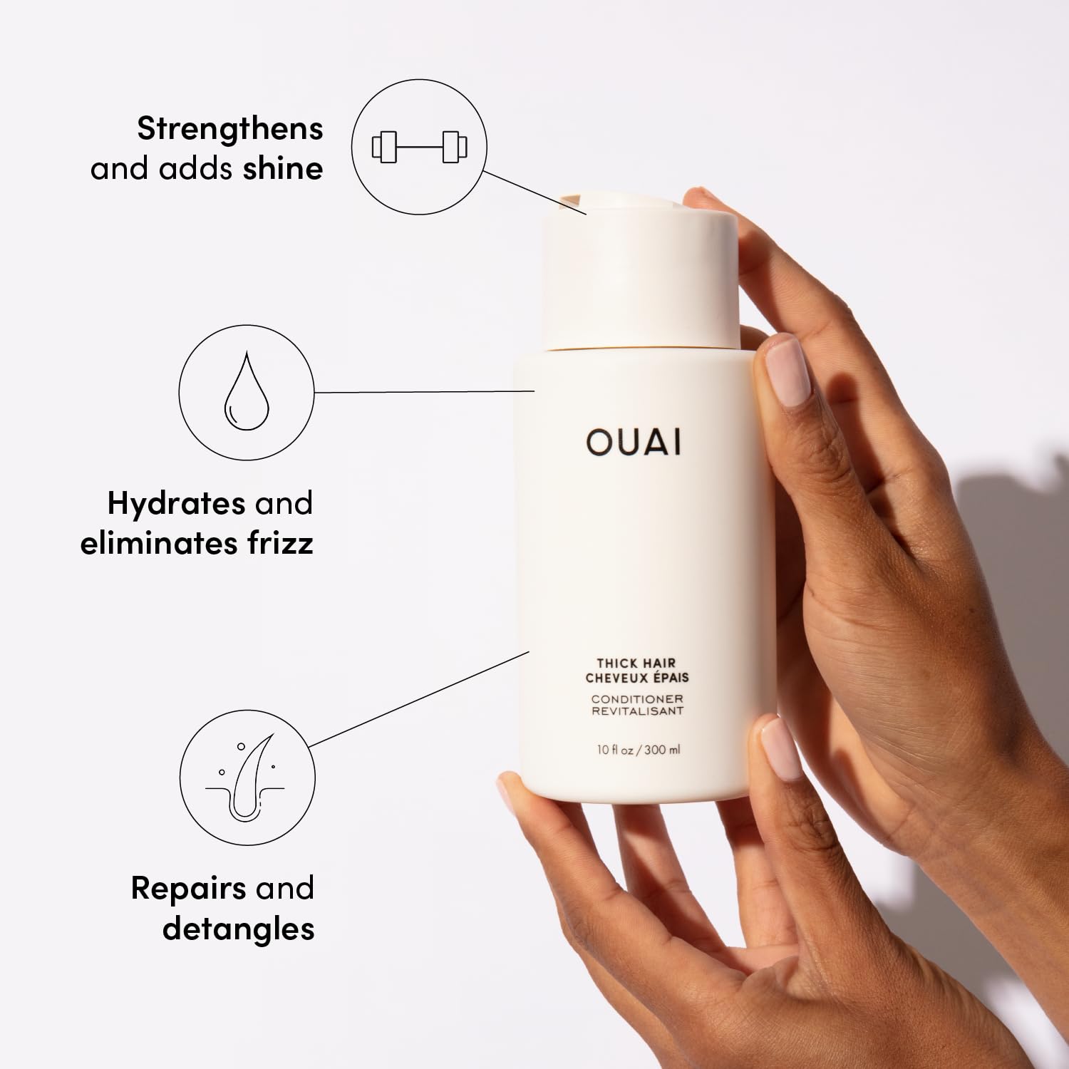 OUAI Thick Hair Conditioner refill bottle closeup showing creamy frizz-control formula