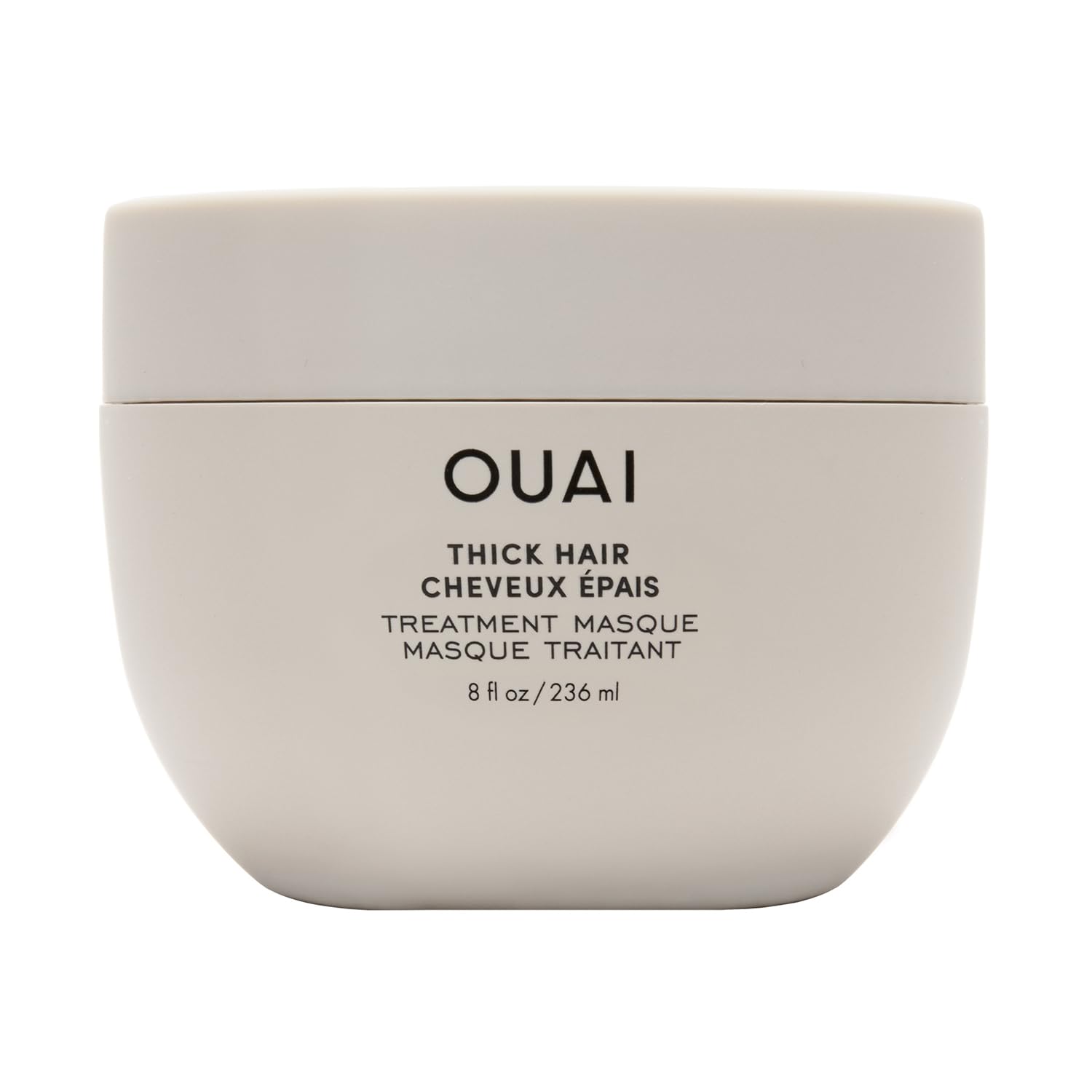 OUAI Thick Hair Mask bottle close-up showing deep conditioning for damaged hair