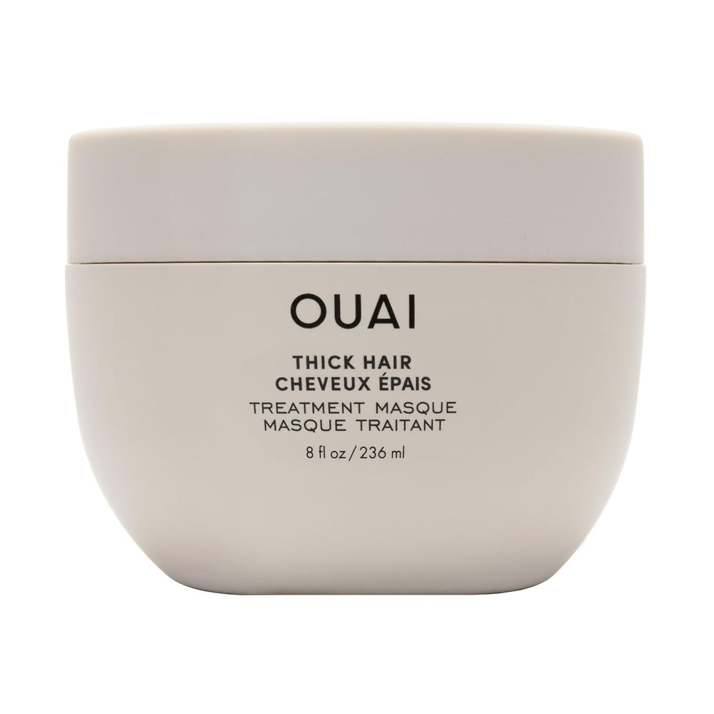 OUAI Thick Hair Mask bottle close-up showing deep conditioning for damaged hair