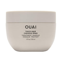 OUAI Thick Hair Mask bottle close-up showing deep conditioning for damaged hair