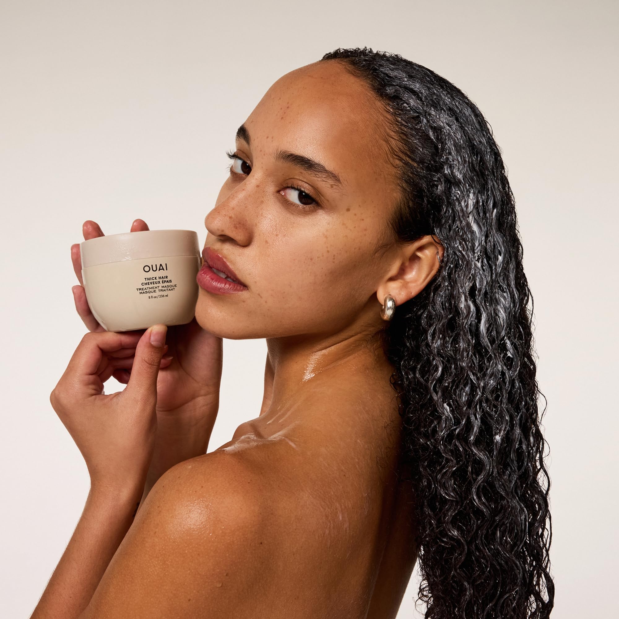 Illipe and shea butters in OUAI Thick Hair Mask conditioning dry hair