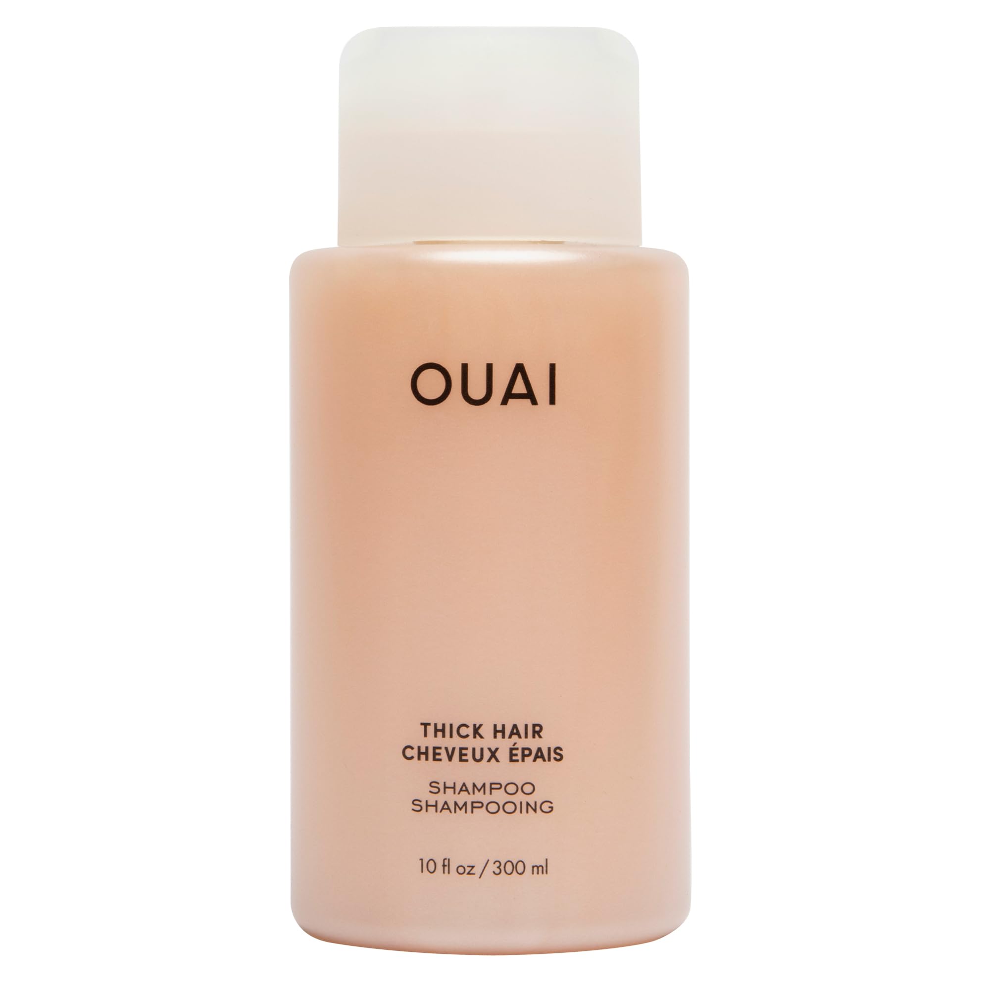 OUAI Thick Shampoo bottle closeup shows rich hydration for thick hair.