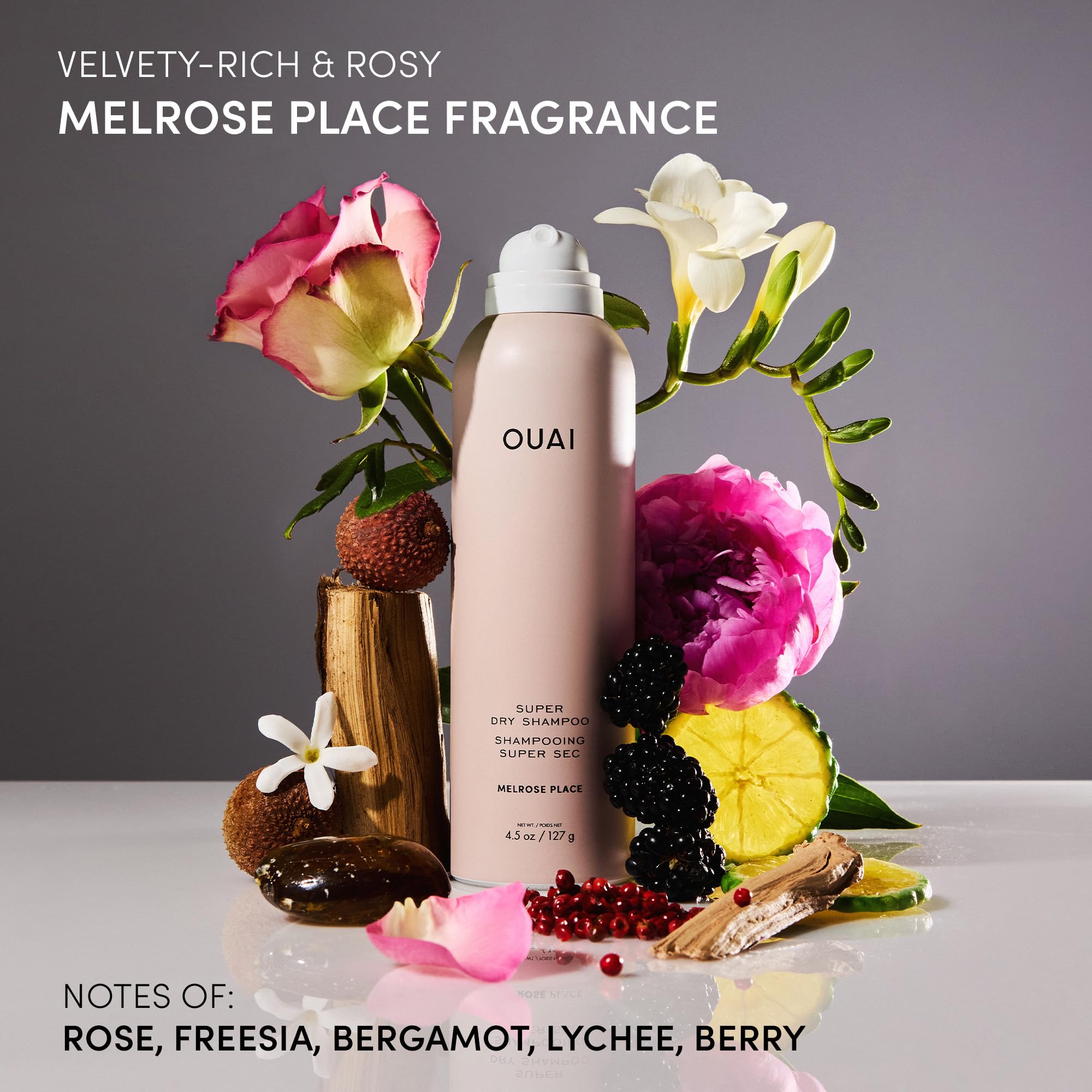 OUAI travel-size packaging displayed for on-the-go styling.