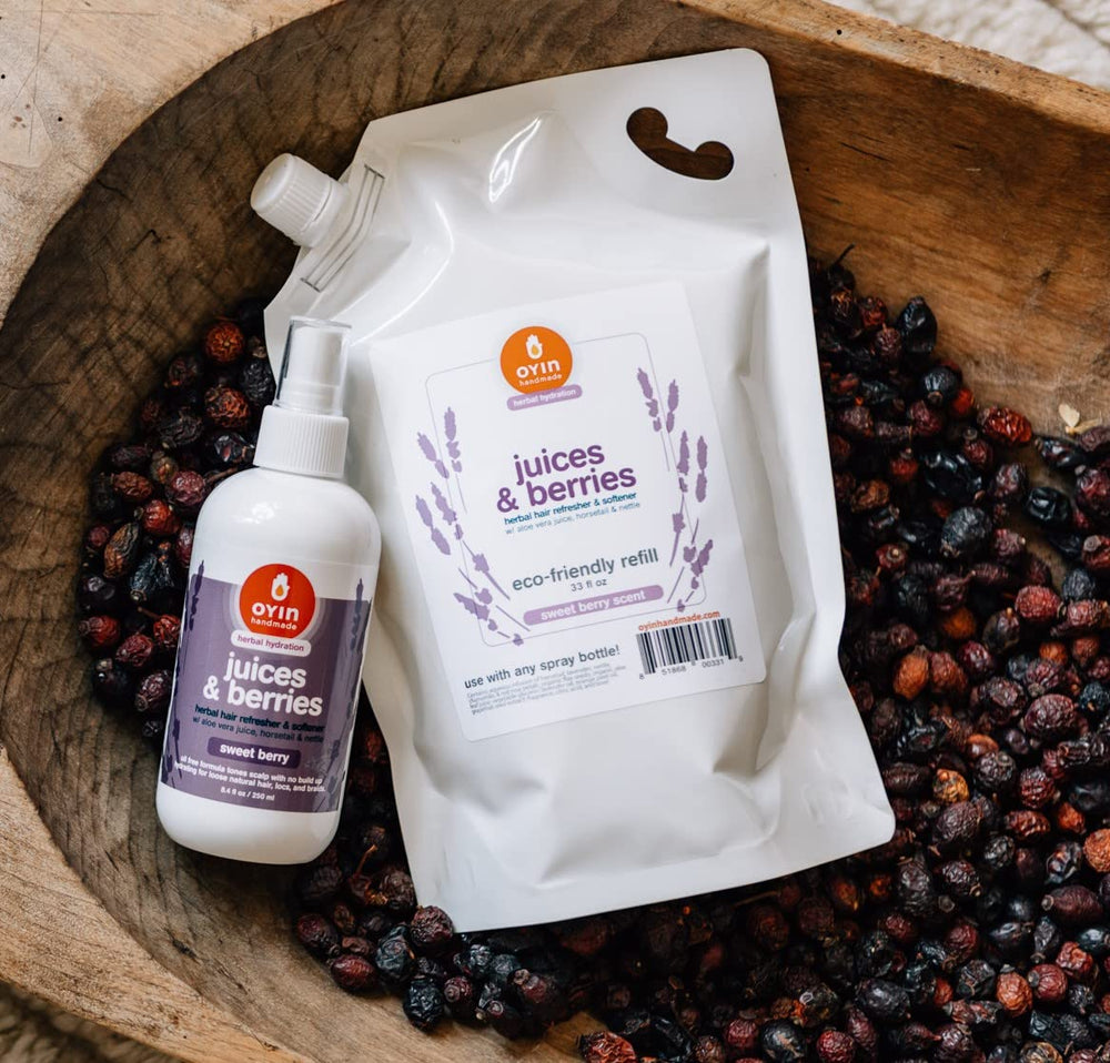 Close-up of ingredients in Oyin Handmade Juices & Berries tonic highlighting detangling moisture.