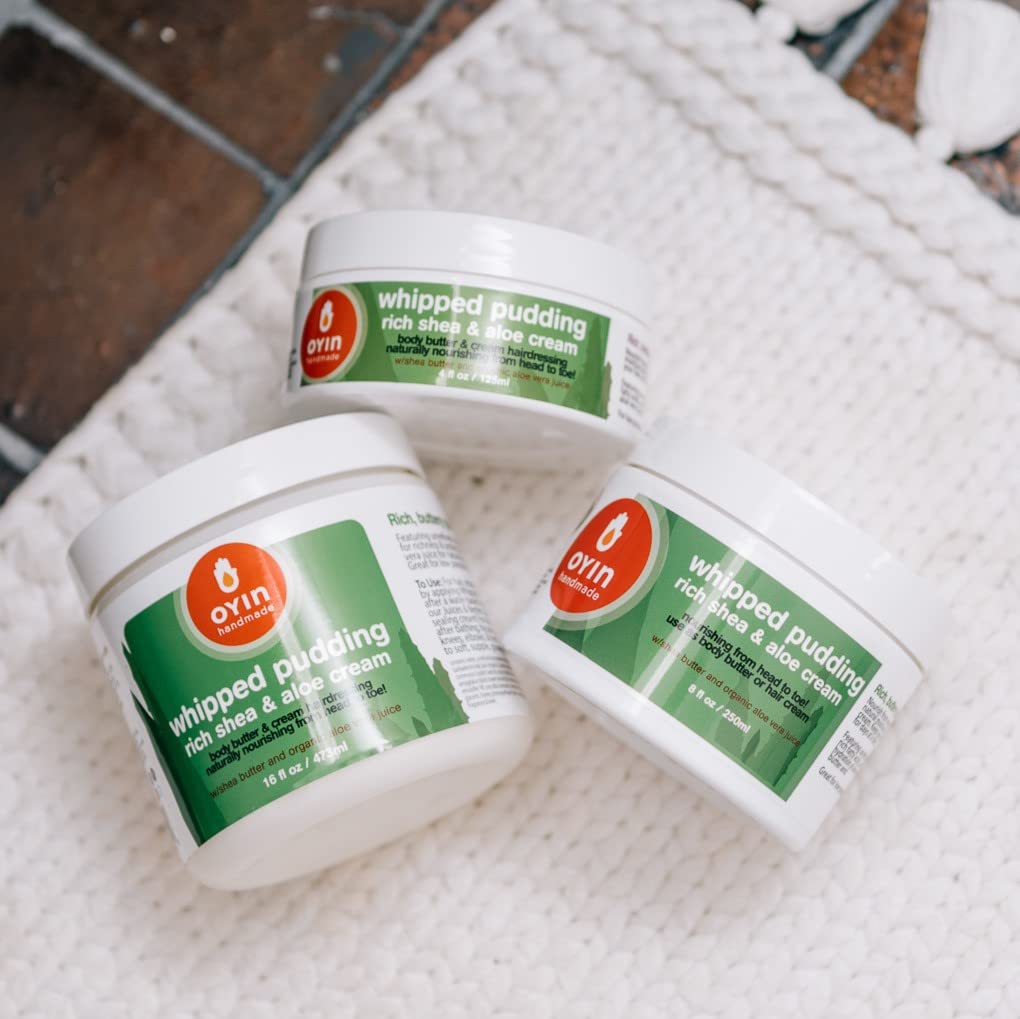 Oyin Handmade Whipped Pudding on hands and face protects against weather.
