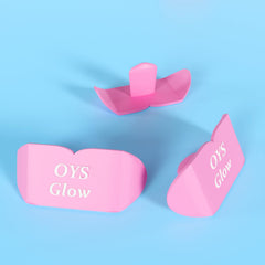 OYS GLOW silicone lip shield on tanning bed highlighting gentle lip barrier during sessions.