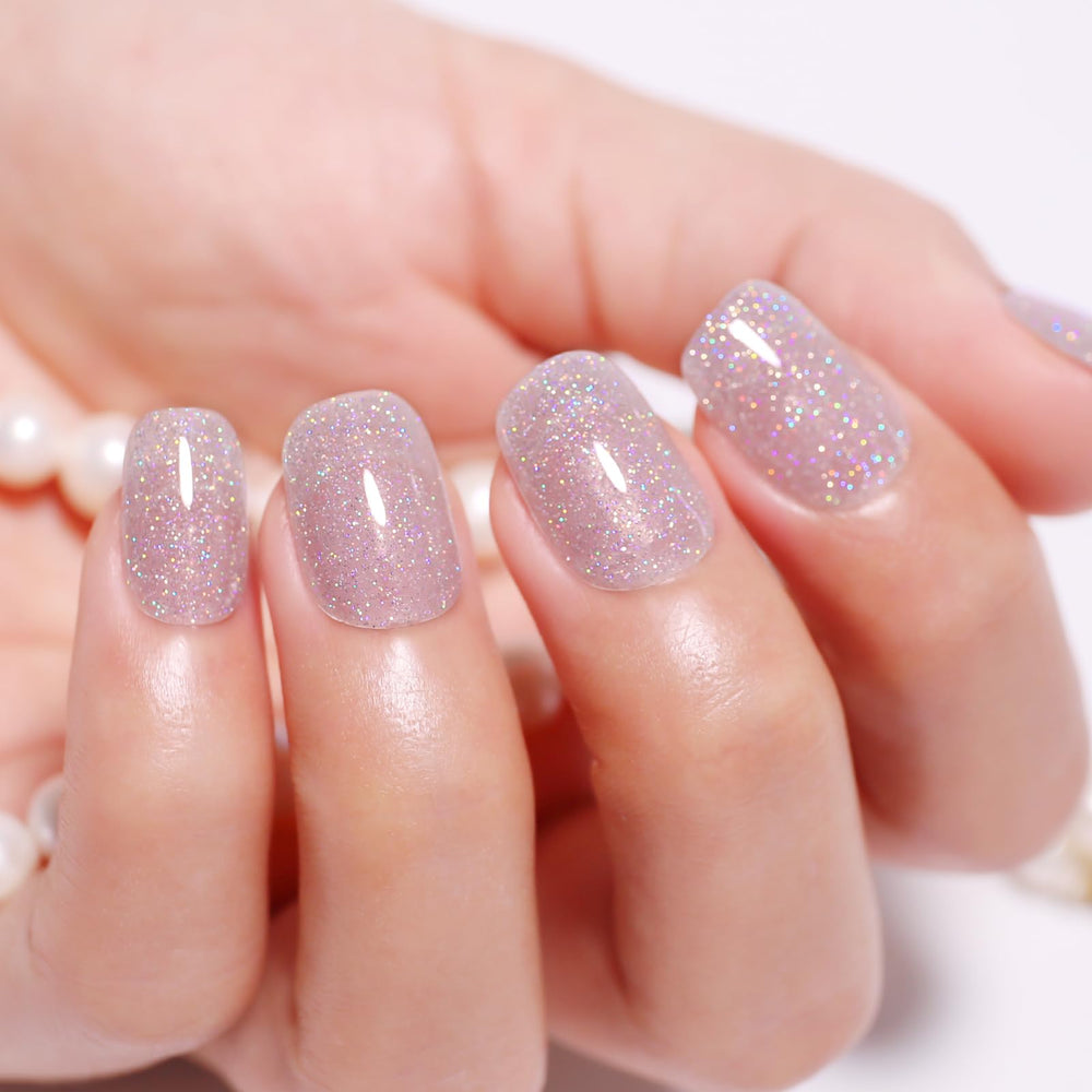 Nails finished in silver sparkle using Ozzeal glitter gel polish